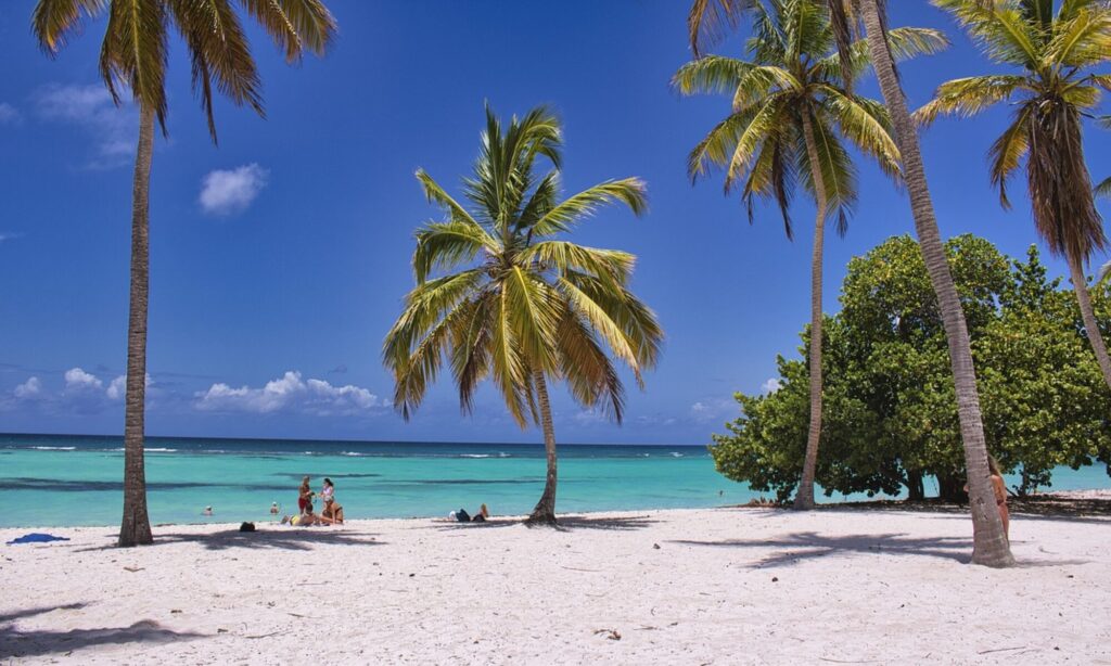 beach background with vacationers relaxing to relate to exchanging your timeshare to different locations