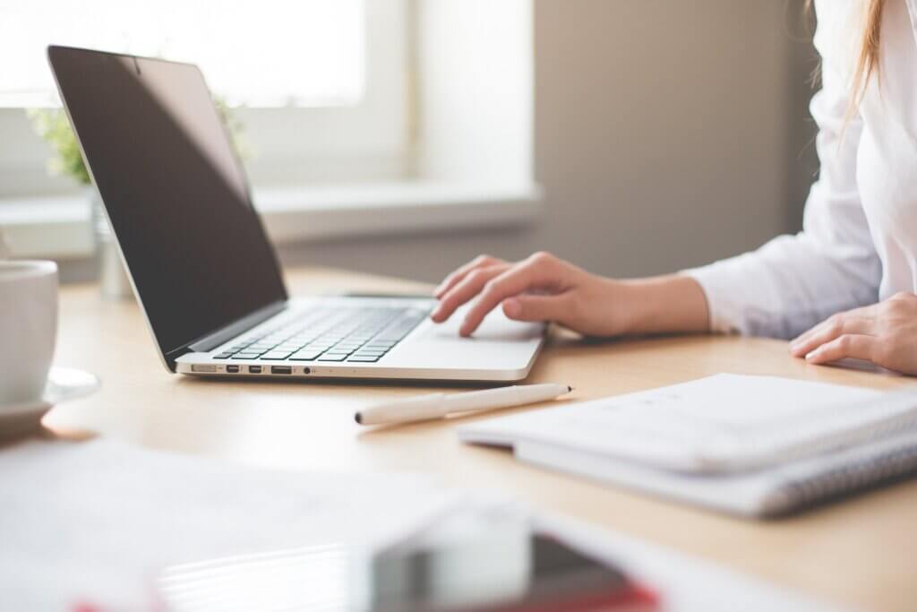 newton group transfer, women at laptop in office setting