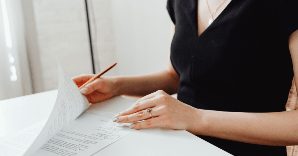 woman signing documents